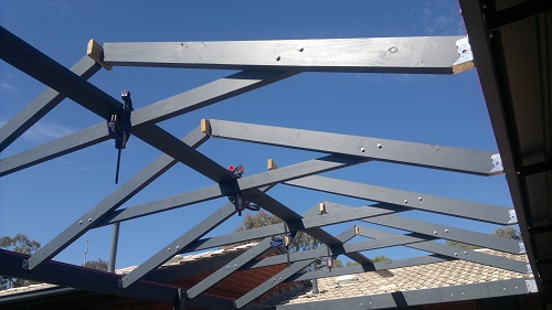 Gable frames in place, ridge about to be lifted into place